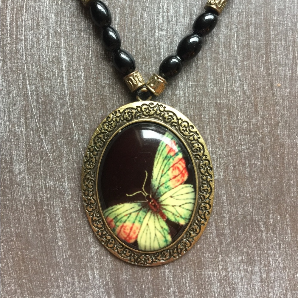 Black Beaded Necklace with Brass Butterfly Pendant